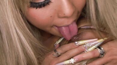 Stunning blond Asian porn star flaunting her goodies and rubbing her wet snatch