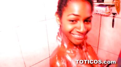 Tiny Dominican babe with unusually large rock hard tits showering on camera