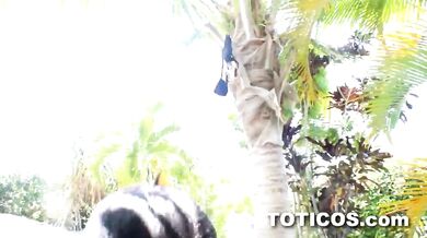 Dominican babe giving black tourist a blowjob out on hotel grounds